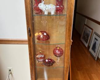 Tall, narrow display cabinet
