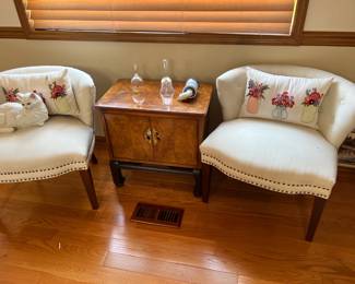 Matching white low-back chairs and table with doors