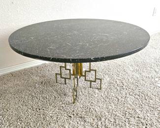 Lot #11 - Hollywood Regency-style round coffee table with Black Marble Top & Ornate Geometric Brass Base 1960's / 70's