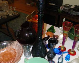 Glow up in the dark glass, and tall blue/teal decanter