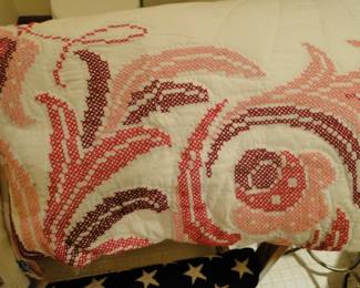 The cross stitched pattern on this magnificent quilt at las count was about 1,999,251,125 gazillion, single hand stitched X's