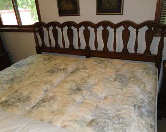 King bed, with Mid Century Modern headboard, clean and neat and made by Serta