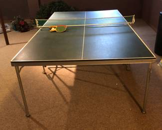 Full size, ping-pong table with paddles and balls included.
