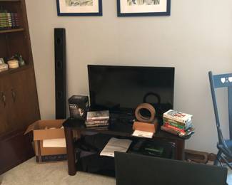 Toshiba flatscreen TV with remotes, TV stands, wall mount TV, blu-ray player.