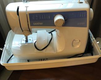 Like new brother, sewing machine. And other miscellaneous sewing items.