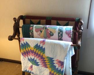 Quilt rack and three quilts