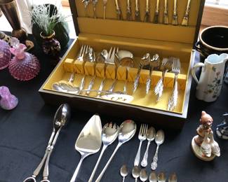 12 piece silver plate set with accessory pieces.