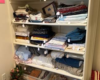 SELECTION OF LINENS & PILLOWS IN MASTER BDRM CLOSET