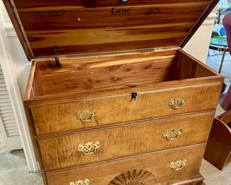 Antique chest with hinged top revealing cedar-lined storage compartment and three drawers; ideal for blankets or linens.