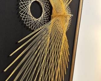 Golden sunburst string art detail