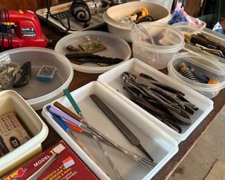 Bins of assorted knives, hardware and small tools