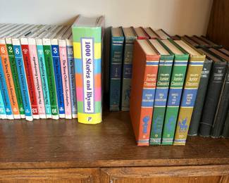 Collection of classic books on wooden bookshelf