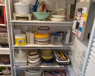 Wire shelving unit with assorted kitchen dishes and bakeware