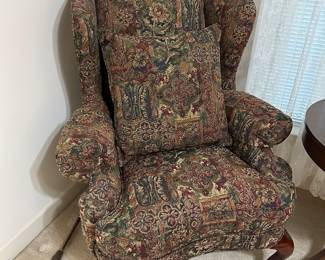 Floral tapestry wingback chair with carved legs