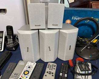 Home theater speaker system with multiple cube speakers and remotes