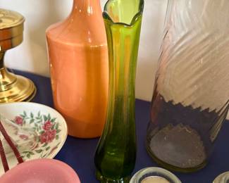 Assorted art glass vases and pitchers in various colors