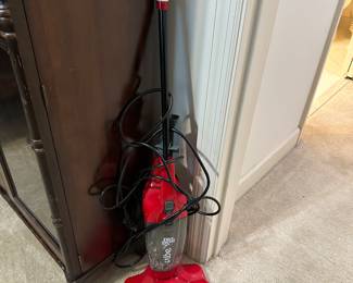 Red upright vacuum cleaner