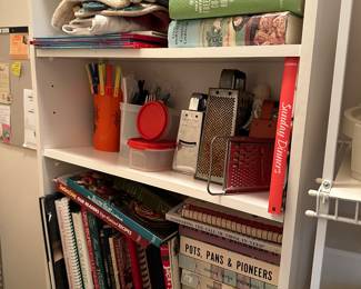 Shelf of board games and craft supplies