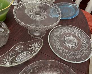 Collection of clear pressed glass serving platters and plates