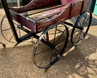 Vintage wooden wagon with metal wheels and handle