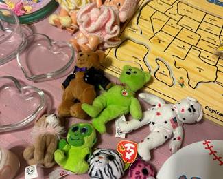 Assorted Beanie Baby plush toys and novelty items