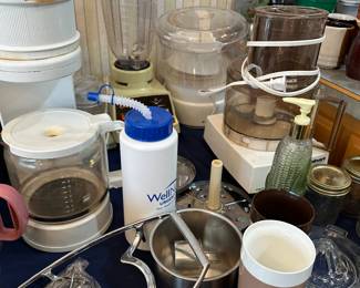 Assorted kitchen appliances and vintage Tupperware pitchers