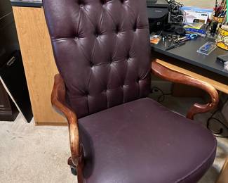Burgundy leather tufted office chair with wood arms