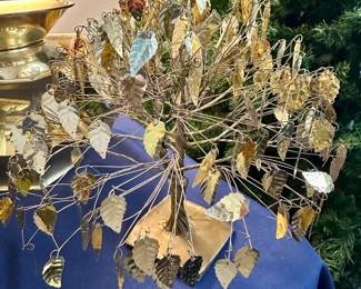 Gold metal chandelier with leaf motifs