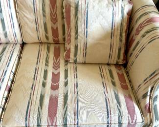 Striped upholstered accent chair matching sofa