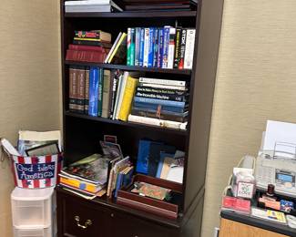 Bookshelf with board games and storage drawers