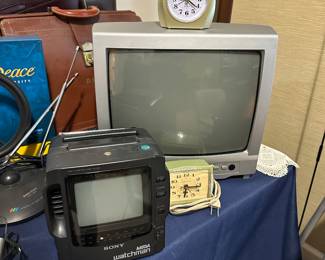 Vintage CRT television with portable TV and clock