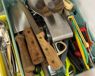 Bin of assorted kitchen tools and knives