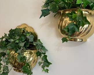 Pair of brass wall planters with artificial ivy