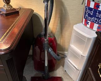 Red upright vacuum cleaner