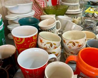 Assorted mugs and teacups with retro floral designs