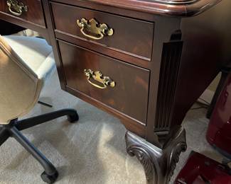 Carved mahogany desk with claw feet