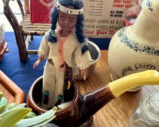 Native American figurine, ceramic jug and wood-handled utensils