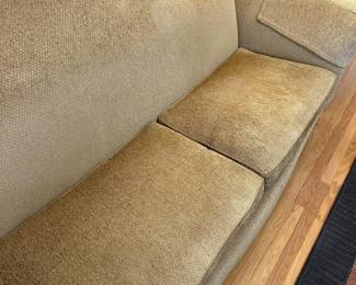 Detail of tan loveseat upholstery