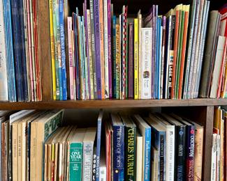 Assorted books and magazines on shelf