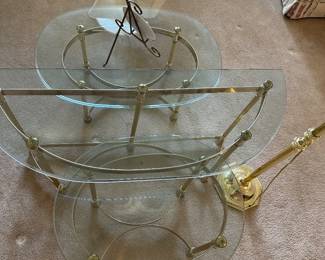 Set of round glass and brass nesting tables