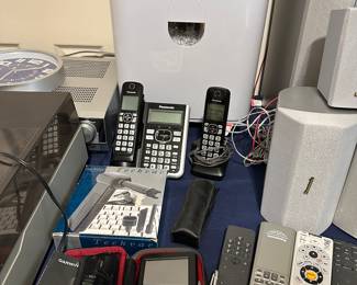Assorted electronics accessories and remote controls