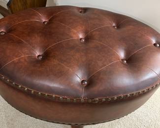 Round tufted leather ottoman
