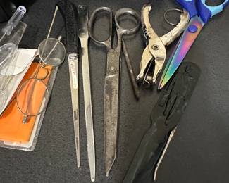 Collection of hand tools including pliers and scissors
