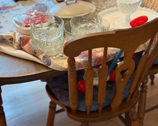 Dining table with 6 chairs, 2 leaves and pad. Glass salad bowl with individual bowls, milk glass chip dish, casserole, chip plate, toy popper.