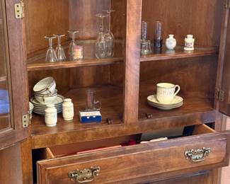 Glassware, tea cups, hutch not for sale.