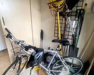 Bike, tent, golf clubs, golf put game, outdoor equipment like rake, shovel, pitchfork, extension cords