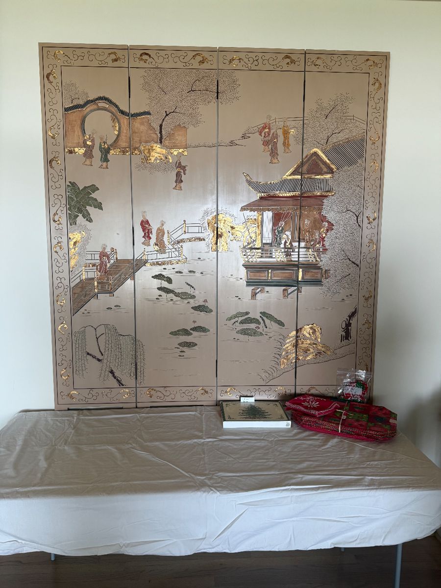 This is a vintage Chinoiserie folding screen.