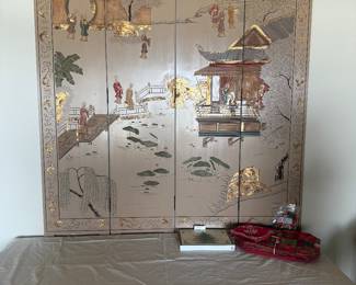 This is a vintage Chinoiserie folding screen.