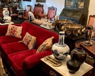 Two large heavy brass punch bowls with matching cups, two marble top side tables