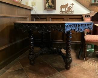 Heavily carved antique dining table.